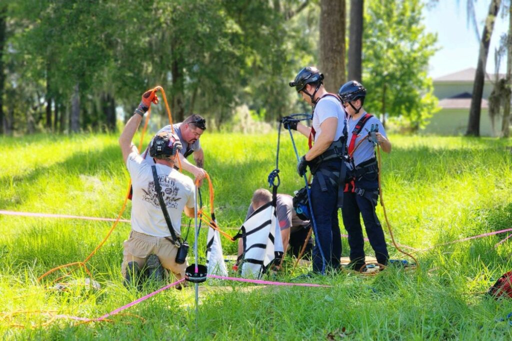 Firefighters rescue a dog from a sinkhole.