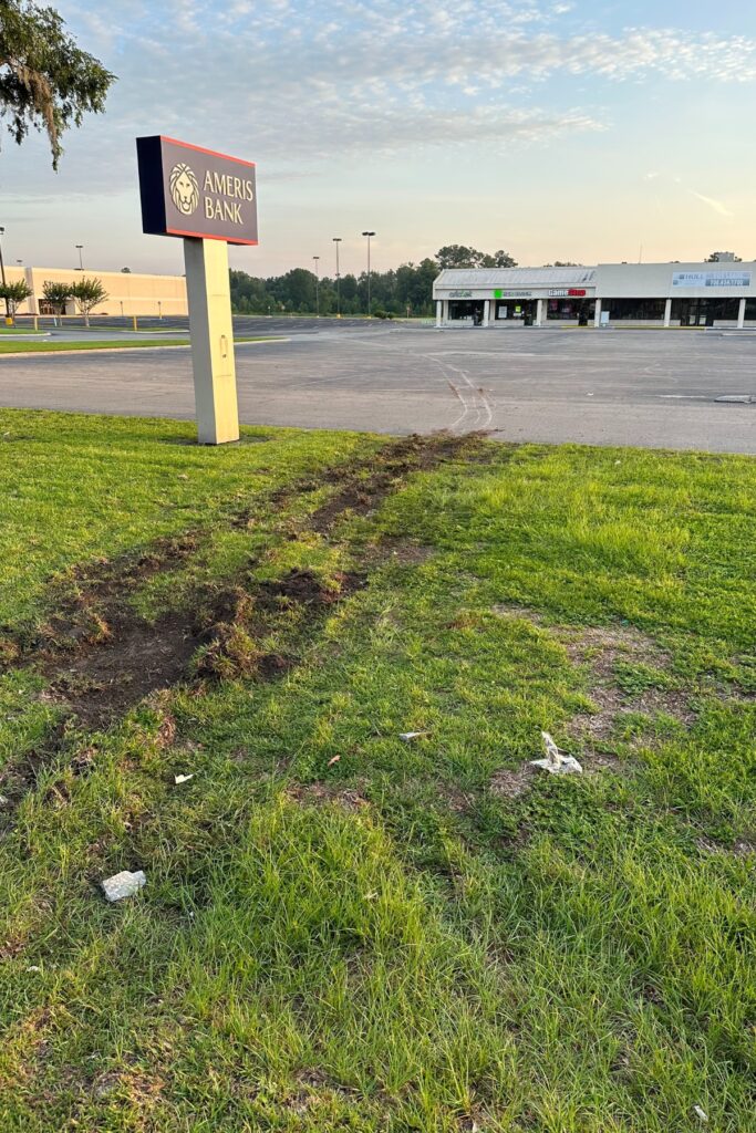 Two individuals used a stolen utility truck to rip an Ameris Bank ATM out of the drive-thru in Lake City Friday morning.
