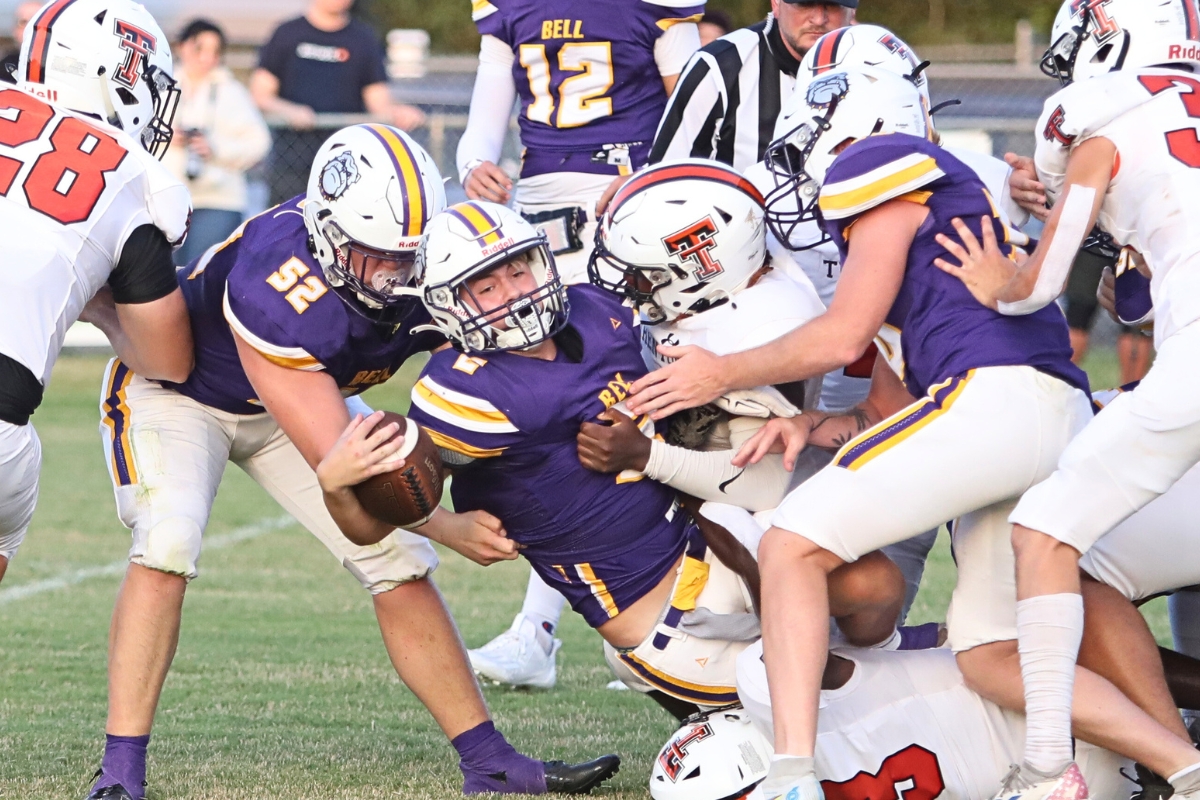 Bell's Isaac Johnson runs for a few yards against Trenton on Thursday.