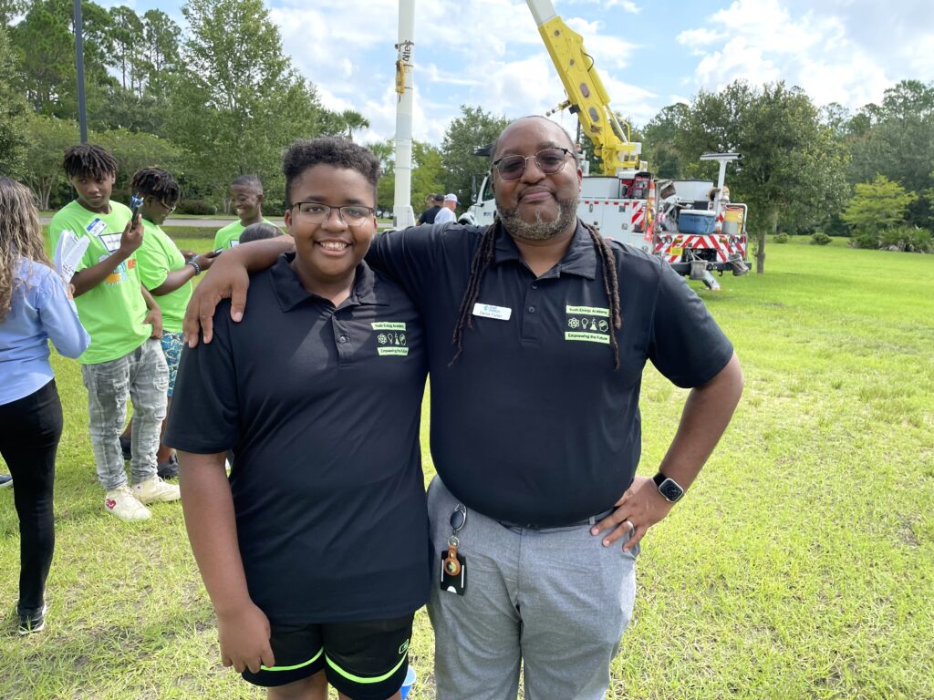 Derick Farfan, right, and his son Mathis, left, at the first Gainesville Youth Energy Academy.