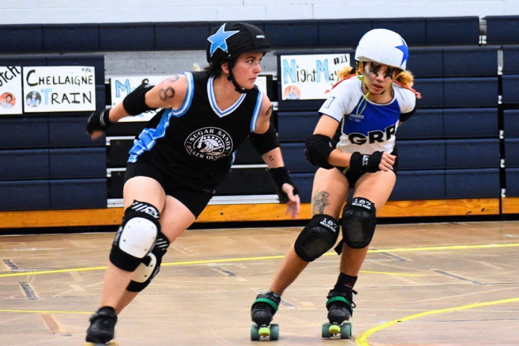 India Sander-Nazaria (right) skates to catch up with the Sugar Sands jammer at a July 8 bout.