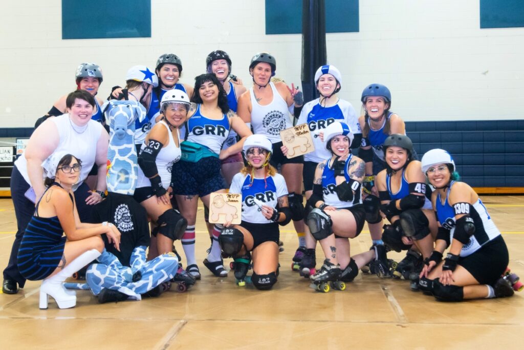 The Gainesville Roller Rebels pose with their trophies after beating the Sugar Sands team on July 8.