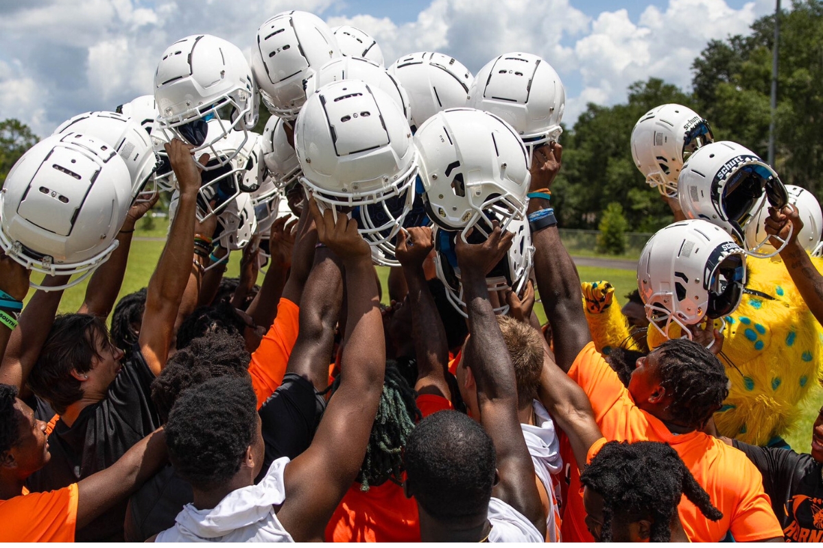 School board acknowledges helmet donation