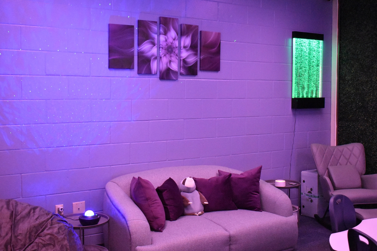 The calm room is painted in cool tones and dimly lit to create a peaceful space.