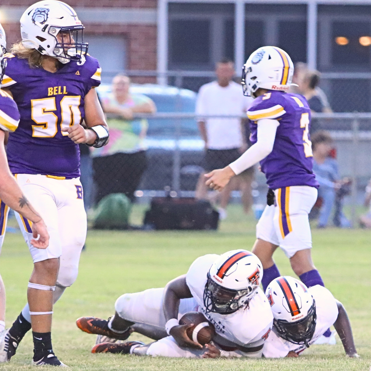 Trenton's Tavin Brown recovers a second quarter Bell fumble in the Tigers 28-0 road win on Thursday.
