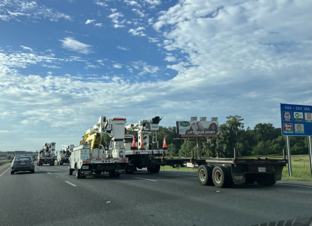 A power truck convoy travels south down I-75 Tuesday morning