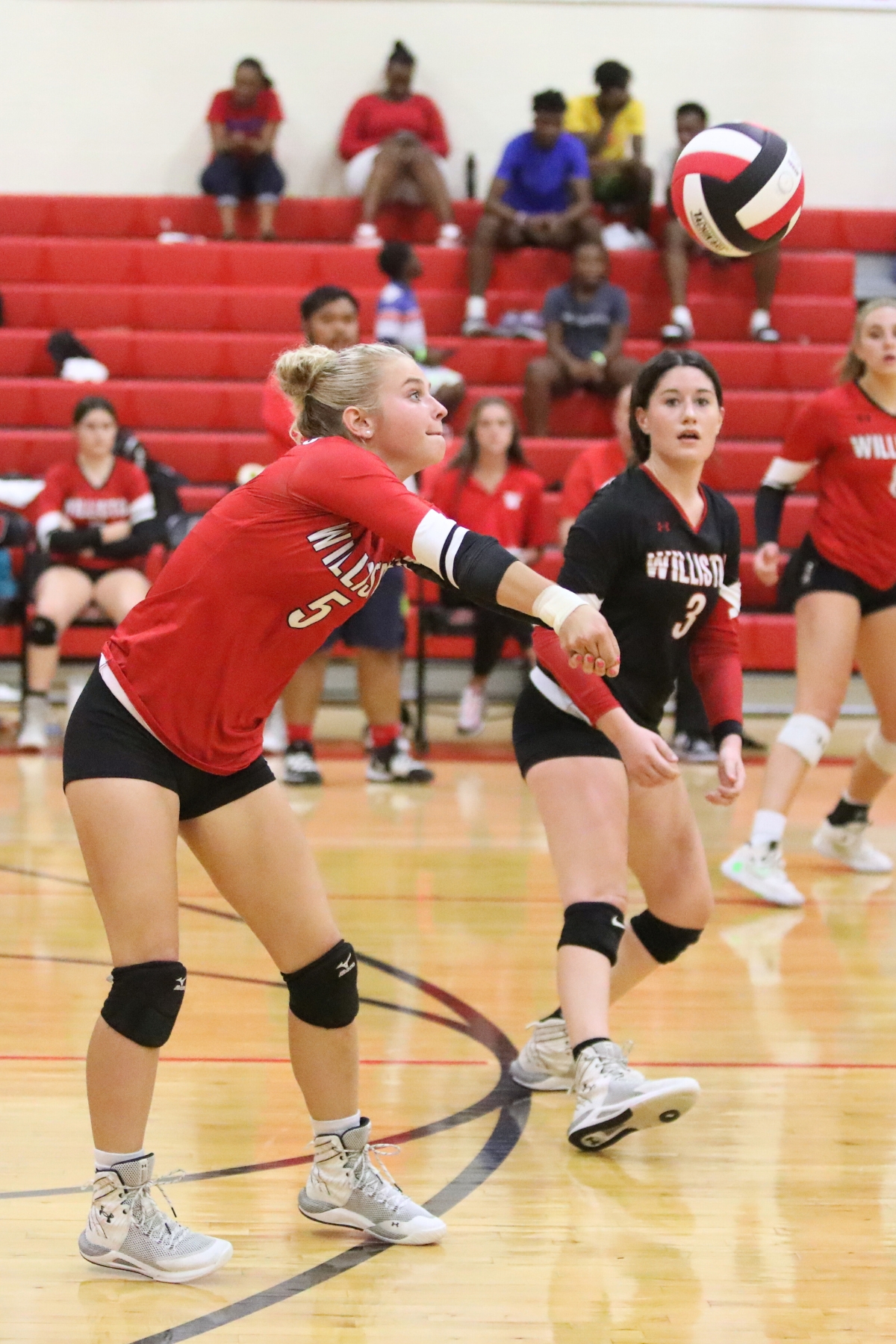 Williston's Josey Tingley (5) with a dig against Oak Hall on Tuesday.