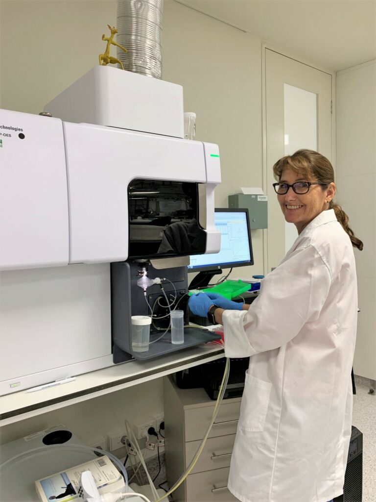 Dr. Marion Bendixen stands at her research equipment.