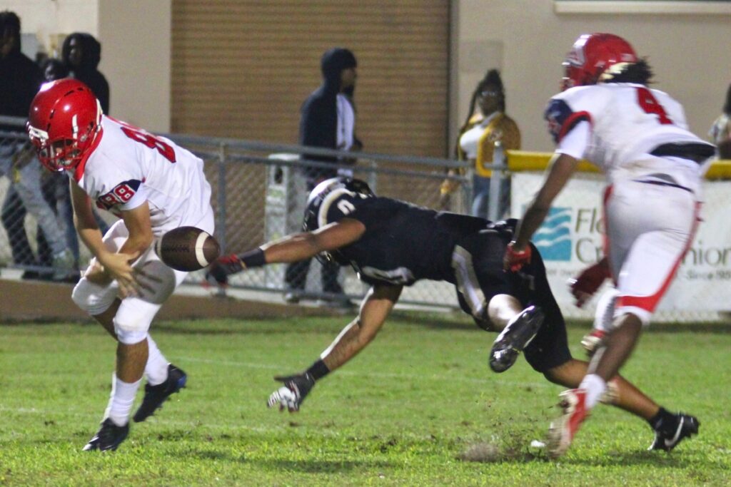 Buchholz recovers a high snap on a Vanguard punt attempt in the second quarter that set the Bobcats up in the red zone on Friday.