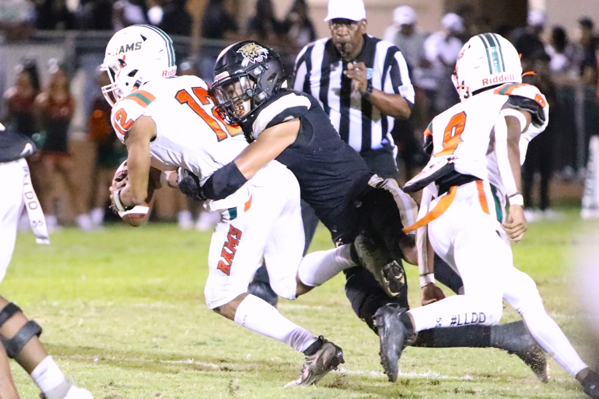 Buchholz's Nick Clayton with a second quarter sack of Eastside's Adrian Curtis on Friday.