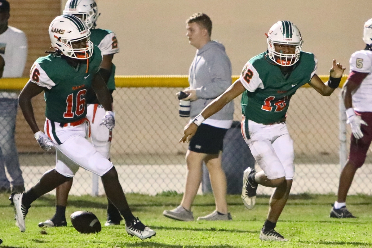 Eastside's Adrian Curtis (12) celebrates afer scrambling for a second quarter touchdown against North Marion on Thursday.