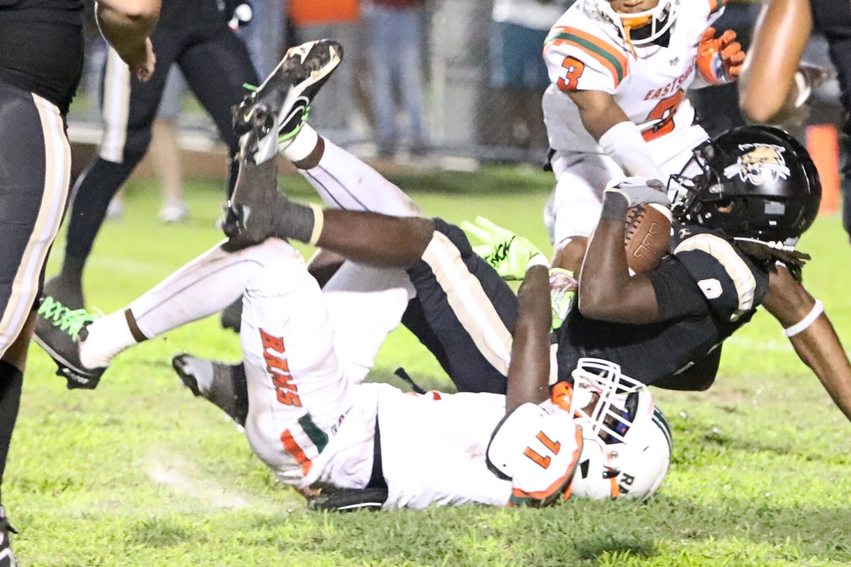 Eastside's D.J. Anderson (11) with a second quarter tackle of Buchholz's D.J. Hicks on Friday.