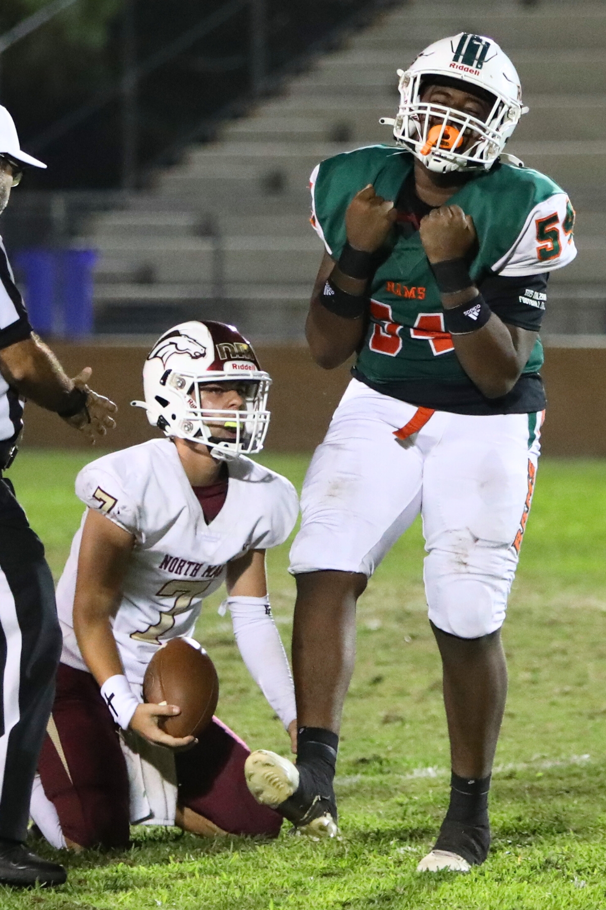 Eastside's Seven Douglas celebrates a first quarter sack against North Marion on Thursday.