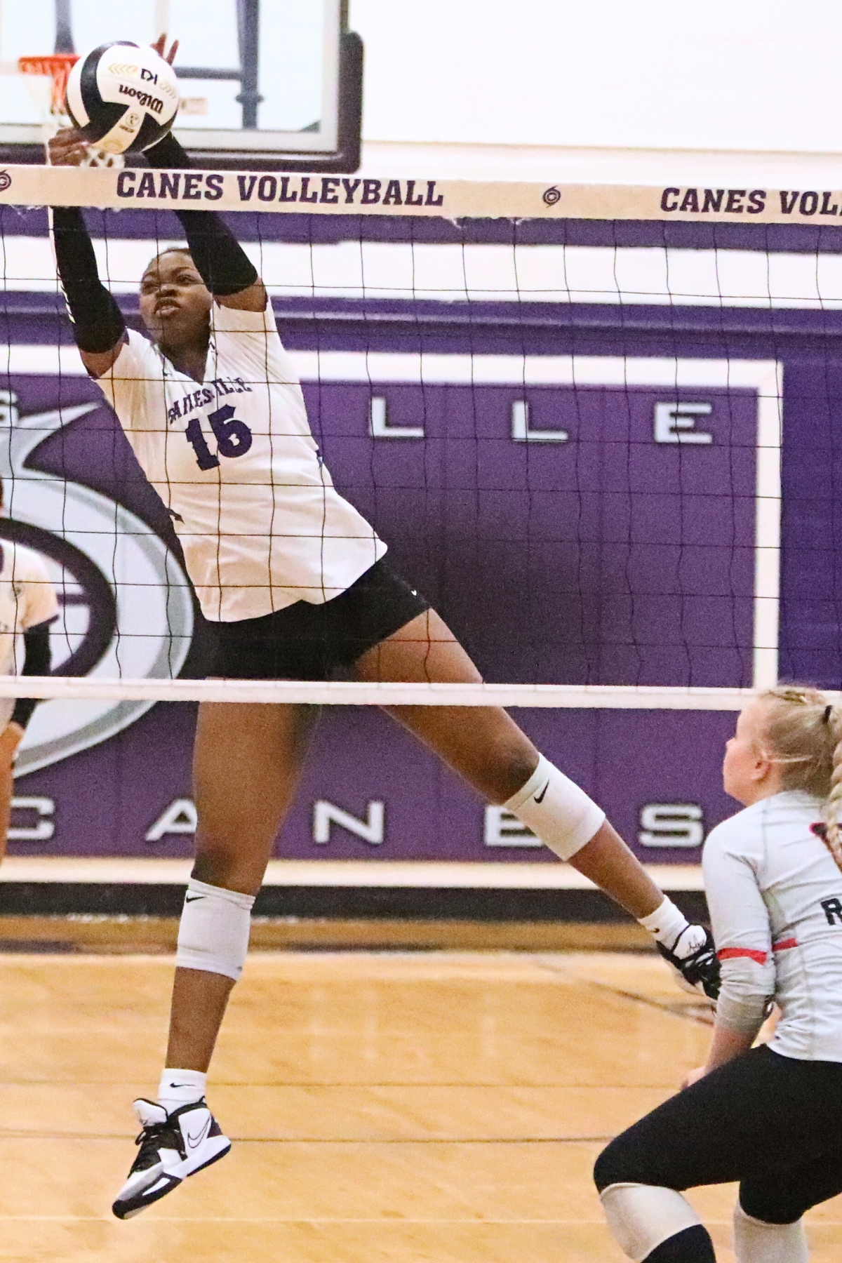 Gainesville Nicole Ellis with a block against Santa Fe on Wednesday.