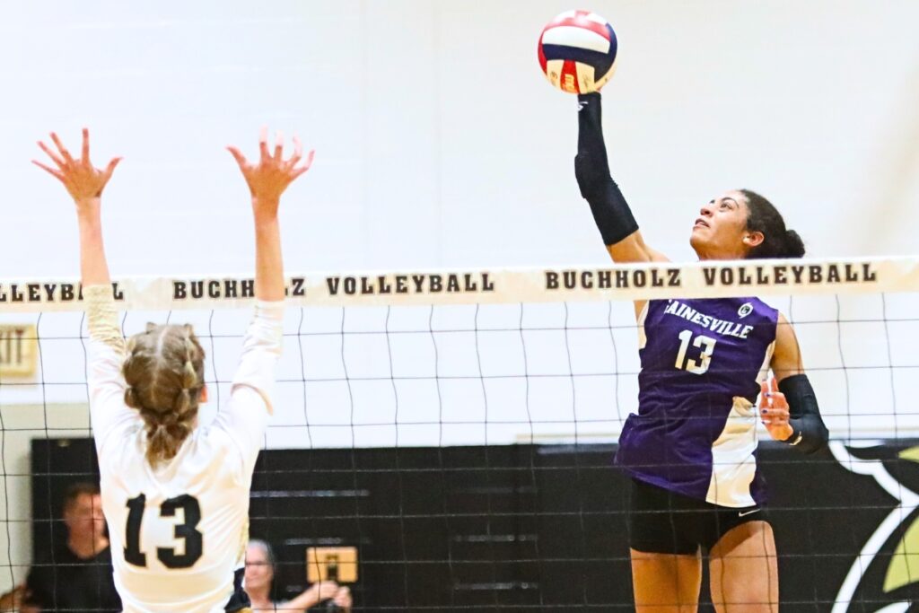 Gainesville's Brooklyn Tealer (13) with a hit against Buchholz's Ava Dunn (13) on Thursday.
