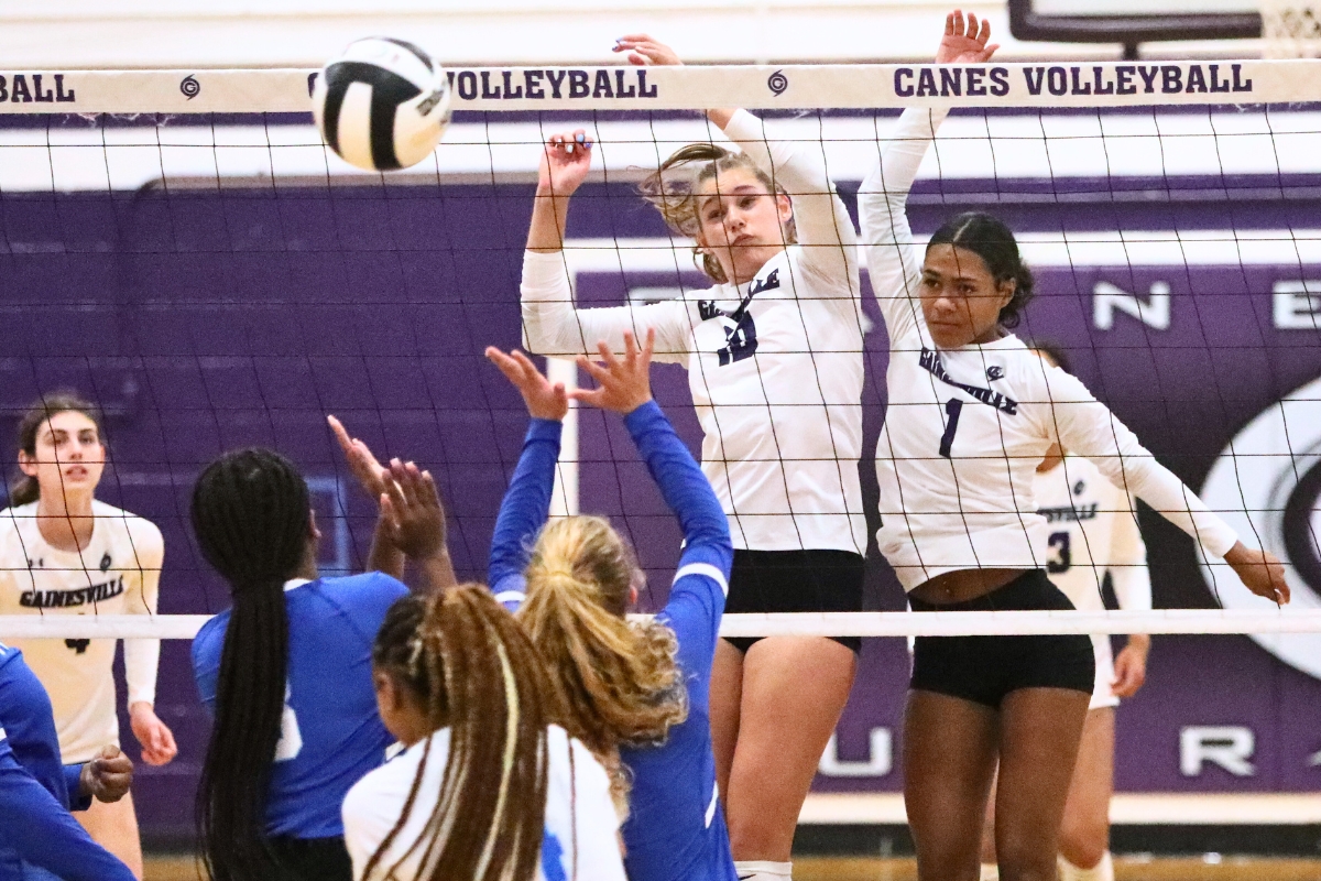 Gainesville's Charlotte Gravlee (10) and Meme Davis (1) with a block against P.K. Yonge on Monday.