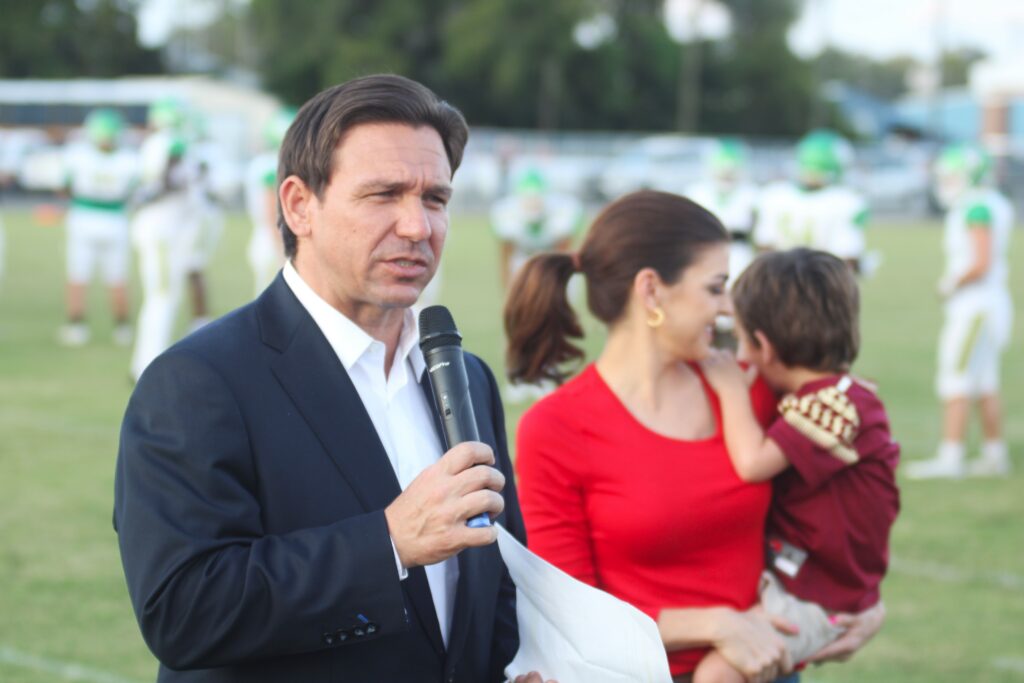 Gov. Ron DeSantis speaks at the start of the Chiefland vs. Suwannee football game.