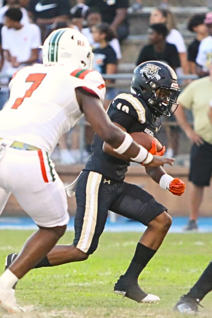 Quinton Cutler took this first quarter handoff for the first score of the game against Eastside on Friday.
