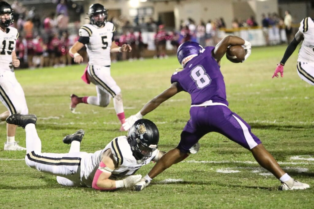 Buchholz's Aiden Brake attempts to tackle Gainesville's Datron Jackson in the second quarter on Thursday.