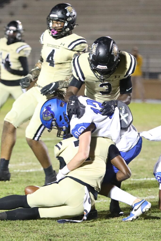 Buchholz's Jorden Moore (7) and Jaleon Powell (3) break up a first quarter pass against Bartram Trail on Thursday.