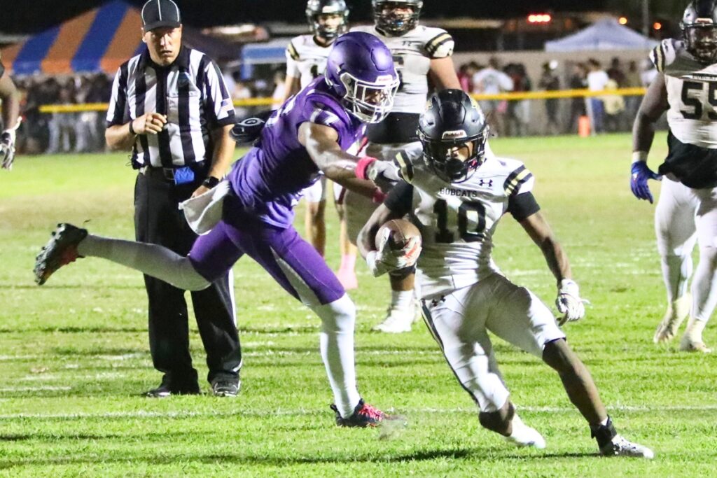 Buchholz's Quinton Cutler breaks a tackle en route to his fourth touchdown in the final seconds of the first half against Gainesville on Thursday.