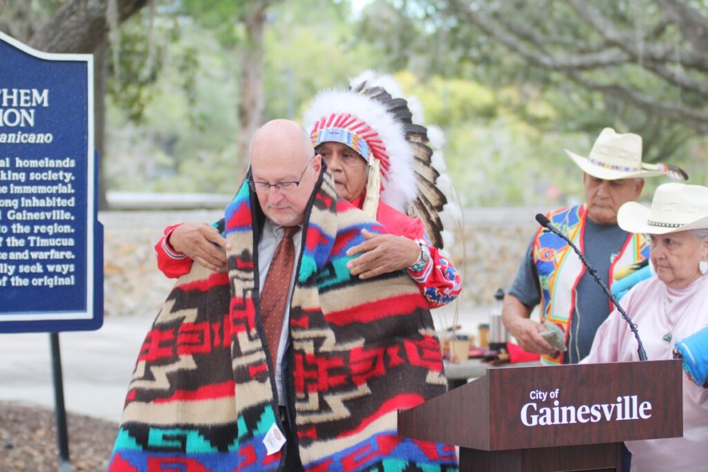 Duane Whitehorse presents Mayor Harvey Ward with a gift in return for the city's proclamation.