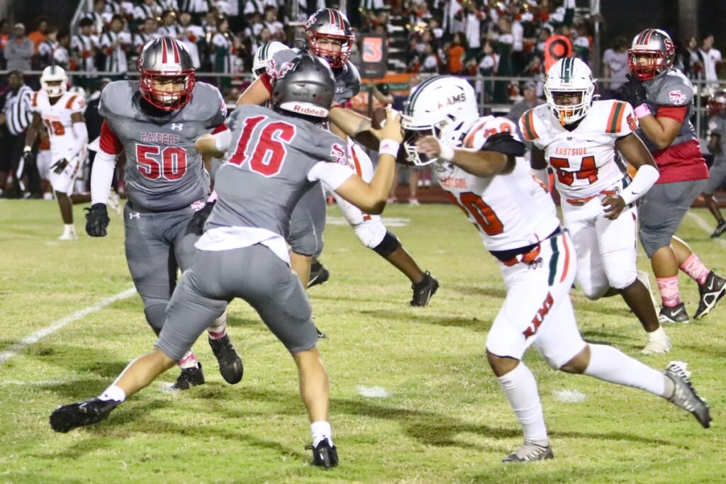 Eastside's Dawan Johnson zeroes in on Santa Fe's Erik Hockman for a sack on Friday.