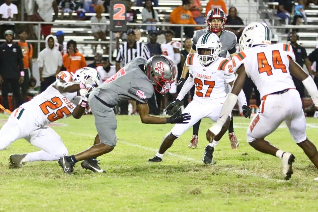 Eastside's Kamariyon Mack tackles Santa Fe's Lionel Walker on Friday.