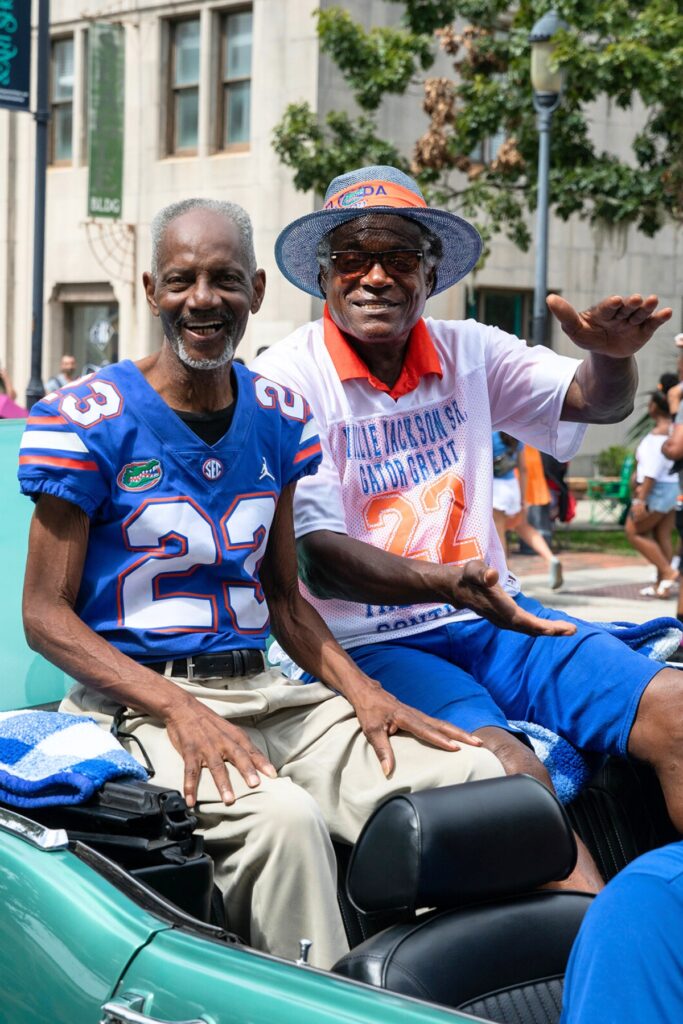 Florida's first black football players Leonard George (23) and Willie Jackson Sr. (22) in UF's Homecoming Parade on Friday. (1)