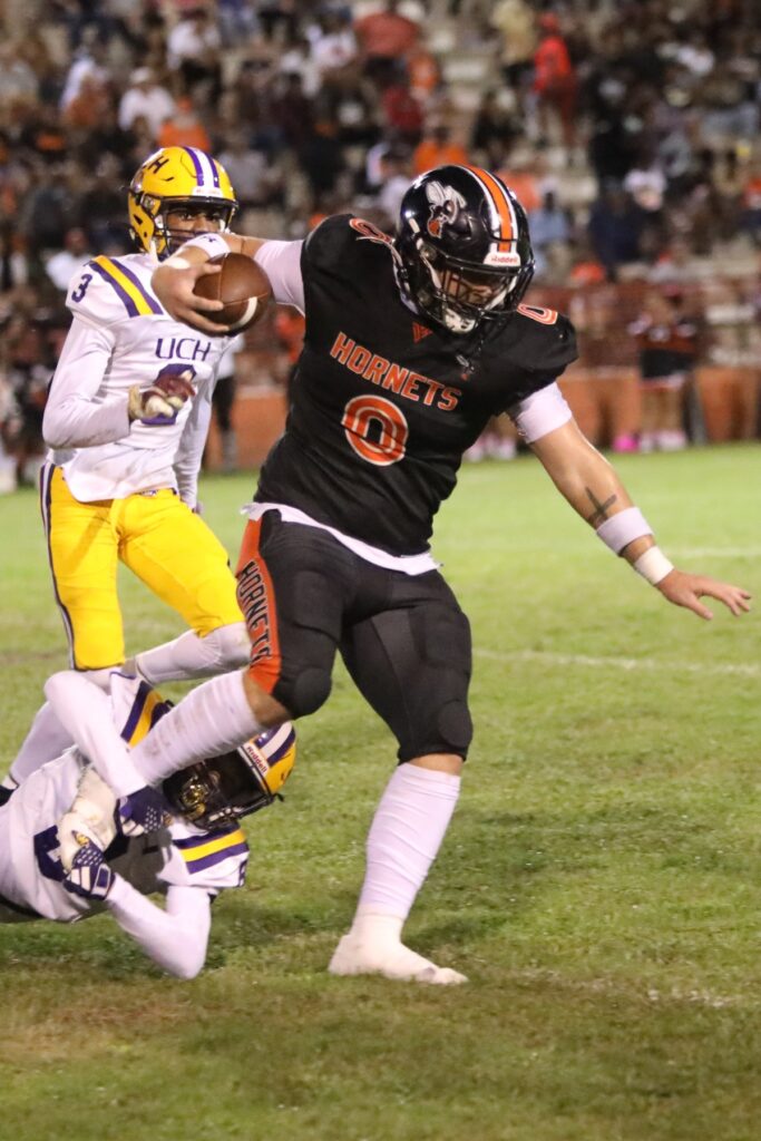 Hawthorne's Andrew Zock gets past Union County's Dayquan Diston on a first quarter catch on Friday.