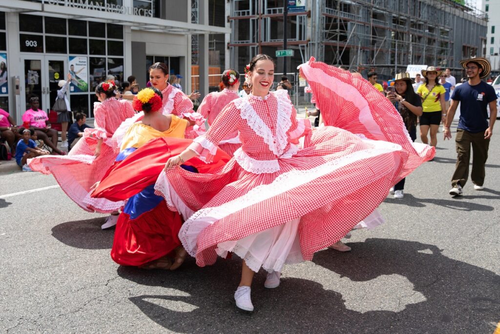 Latino dancers at the UF Homecoming Parade on Friday.