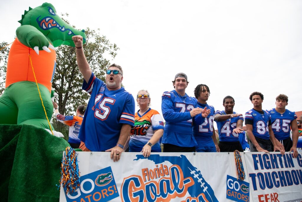 Players from the Florida Gators football team in a float at the UF Homecoming Parade on Friday.