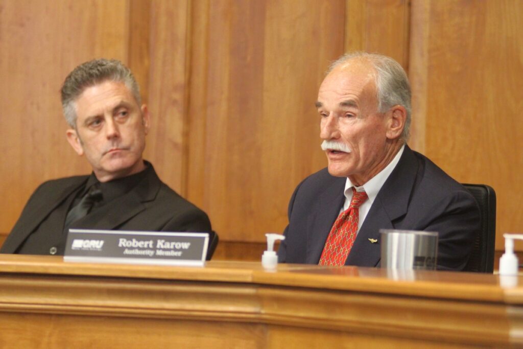 Robert Karow (right) speaks during the first meeting of the Gainesville Regional Utilities Authority.