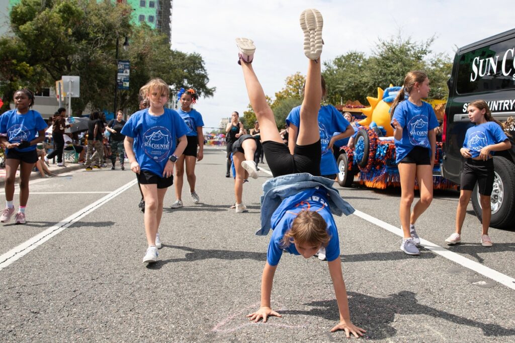 Sun Country Sports gymnasts at the UF Homecoming Parade on Friday.