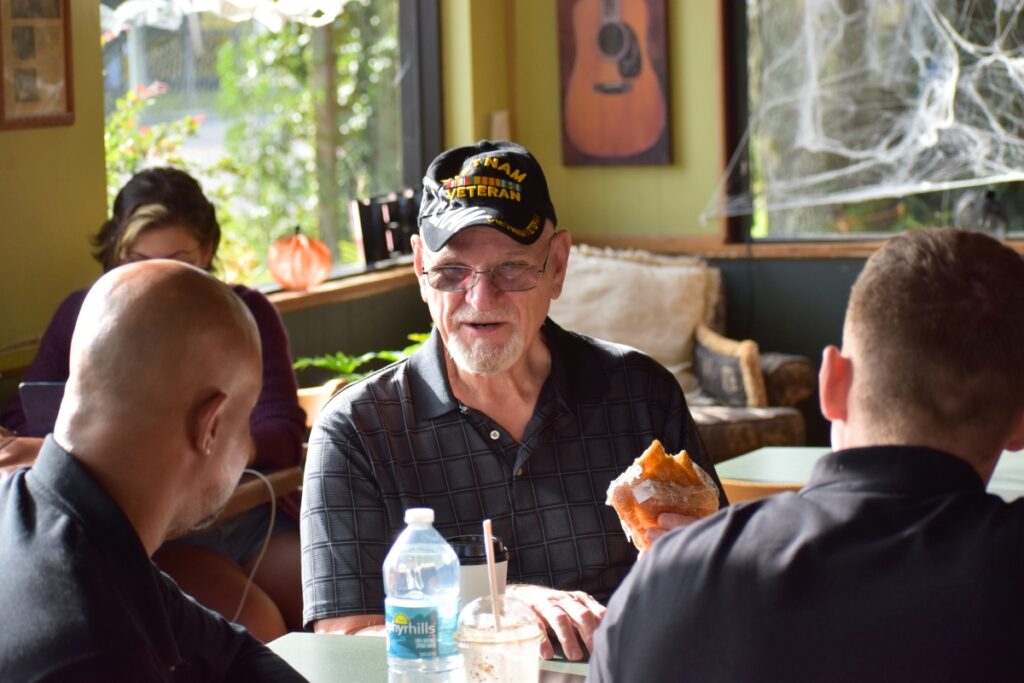 T.J. Miedzianowski (center) came to Coffee with a Cop because he wanted to show his support to the officers.