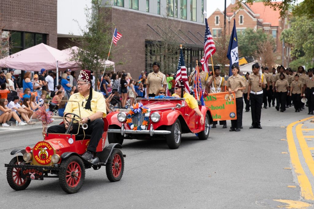 The Shriners followed by the Eastside High School Navy Junior Reserve Officers Training Corps at the UF Homecoming Parade on Friday.