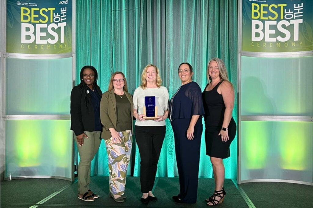 (From left) Cultural Affairs Manager Carol Velasques Richardson; Assistant Director Leslie Ladendorf;, Program Coordinator Kim Harris, Director Roxana Gonzalez and Depot Park Manager Tiffany Coogan.