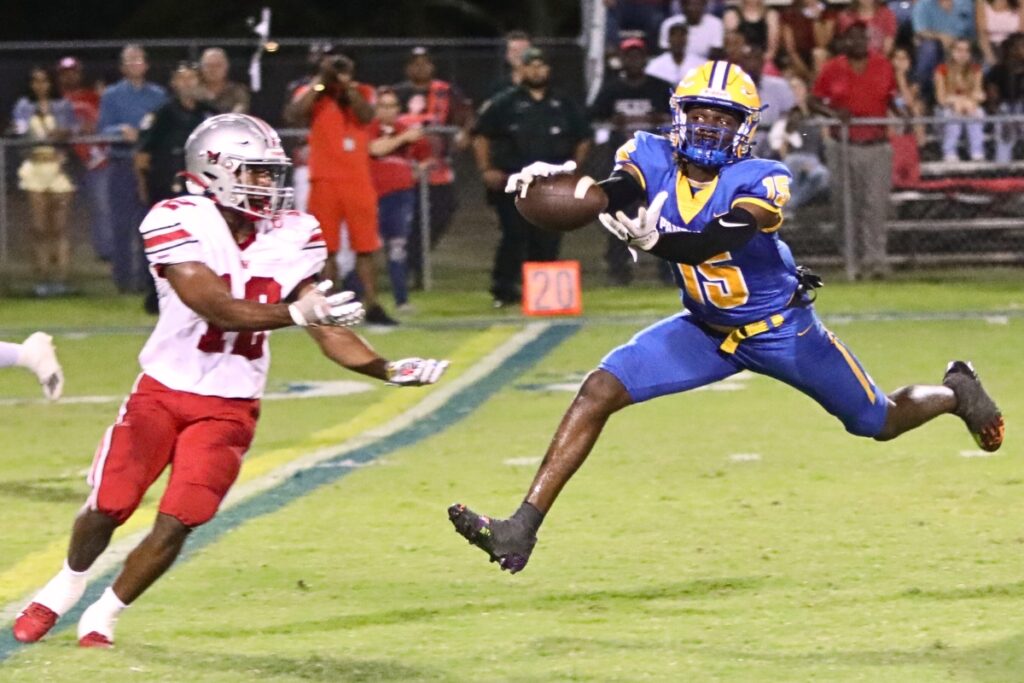 Williston's Ryan Donald (12) breaks up a pass intended for Newberry's Jayden Holcombe (15) on Friday. (1)