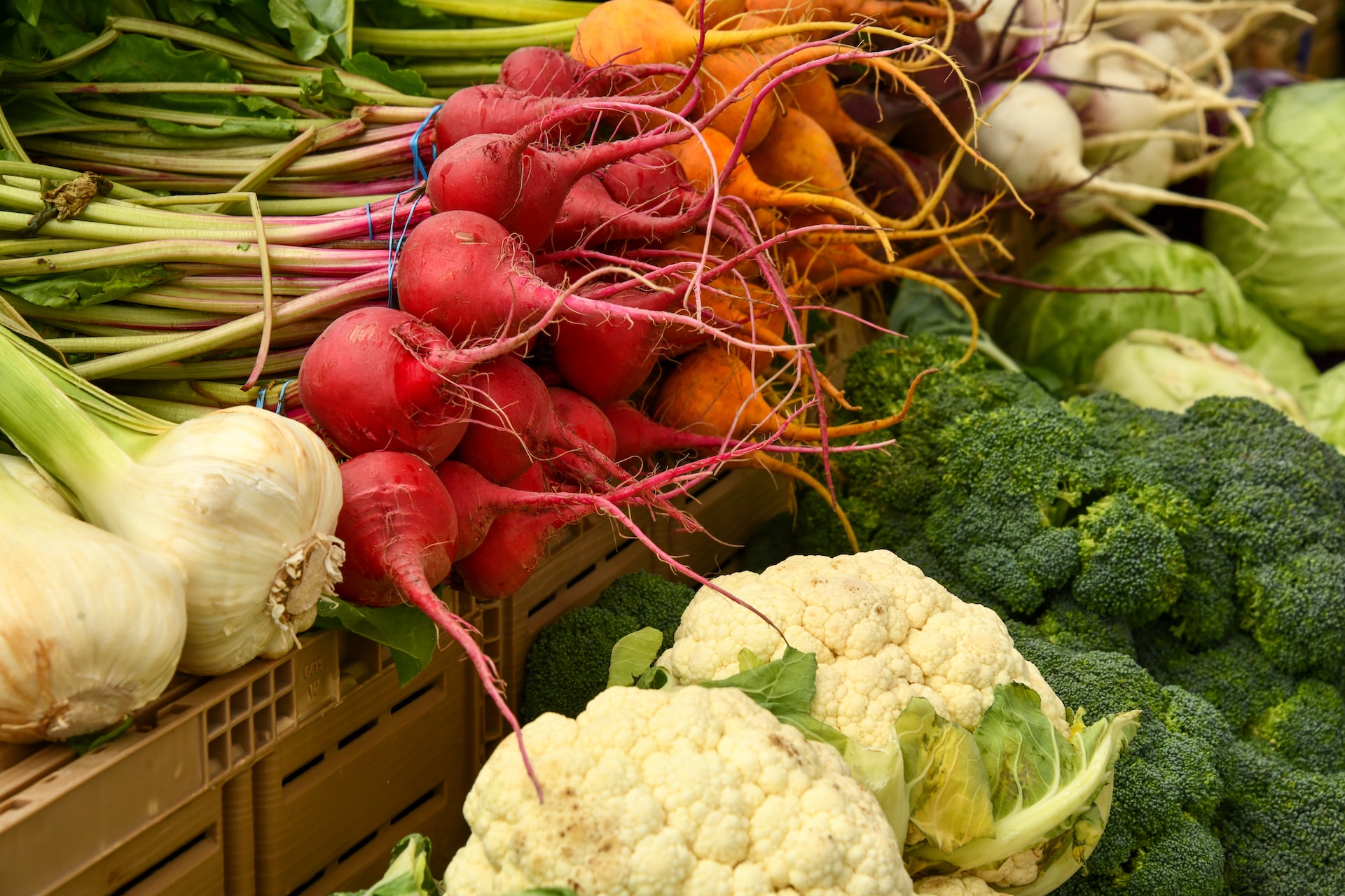 Produce stacked at a farmer's market.