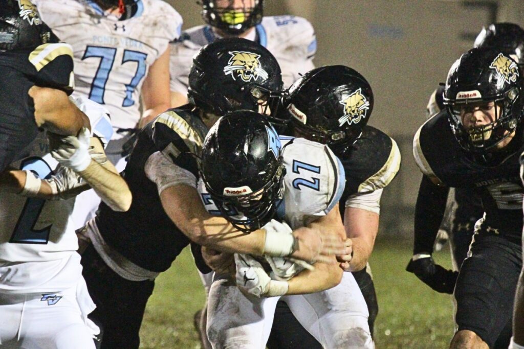 Buchholz defenders tackle a Ponte Vedra on Friday.