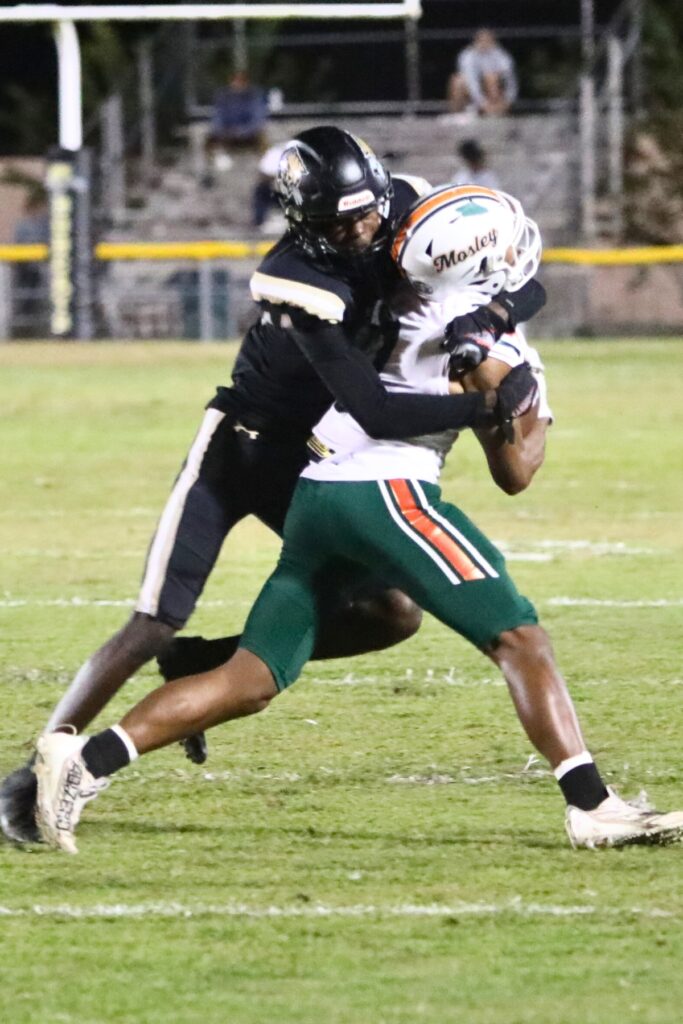 Buchholz's Taylor Carter with a tackle against Mosley on Thursday.