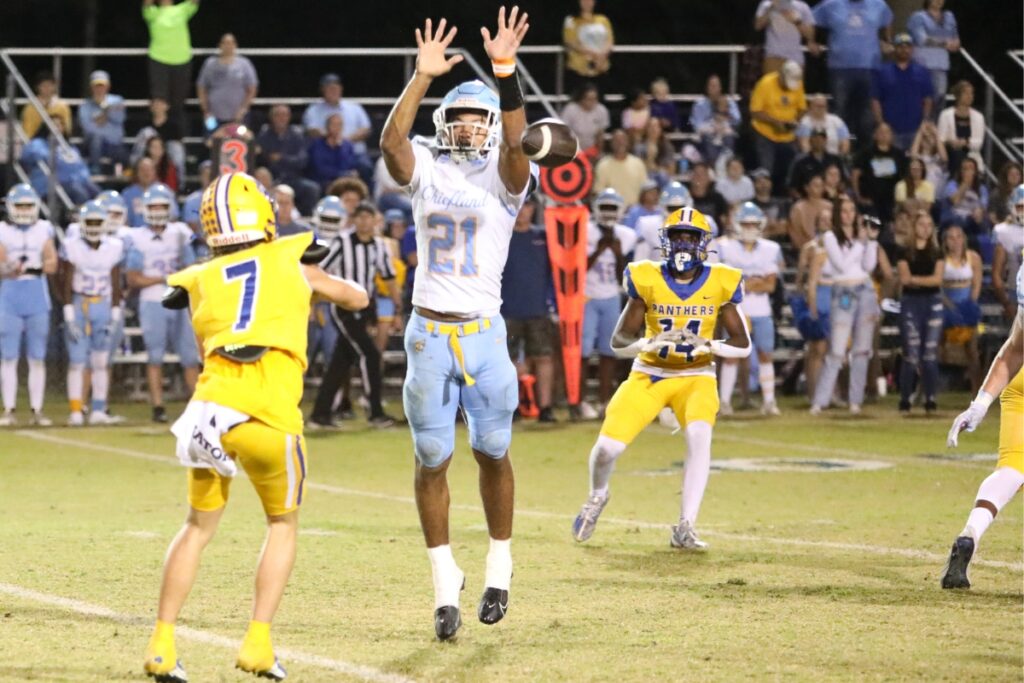 Chiefland's Jon Adams pressures Newberry's Keil McGriff on a pass completion to Hayden Moore in the first quarter on Friday.