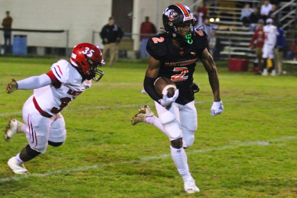 Hawthorne's Alvon Isaac races past a Blountstown defender on Thursday.