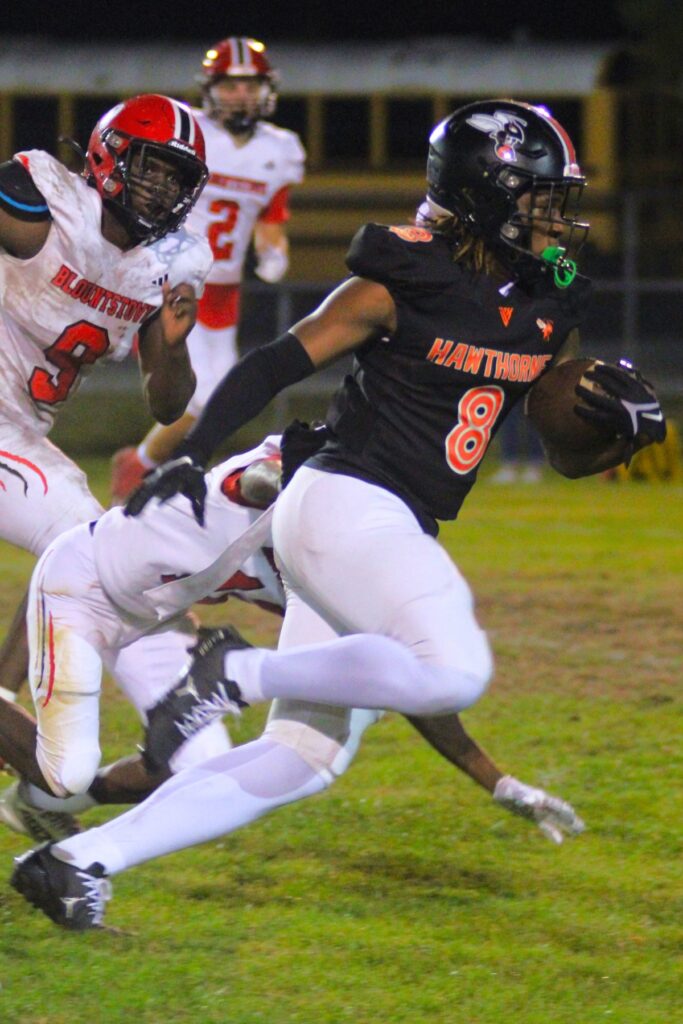 Hawthorne's Caleb Rollerson breaks tackles resulting in a first down against Blountstown on Thursday.