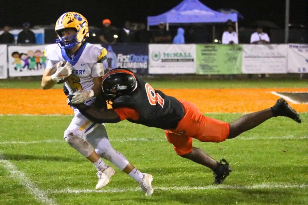 Hawthorne's Keenon Johnson forces Newberry's David Schmidt out on a second quarter kickoff return on Friday.