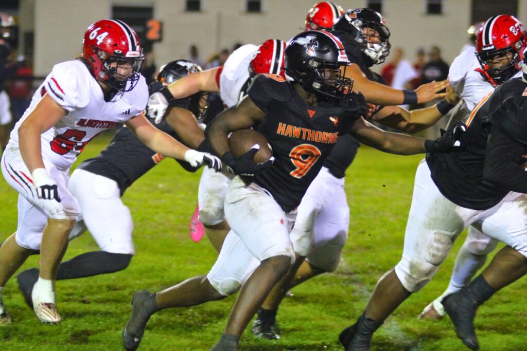 Hawthorne's Kennon Johnson follows teammates on a run against Blountstown on Thursday.