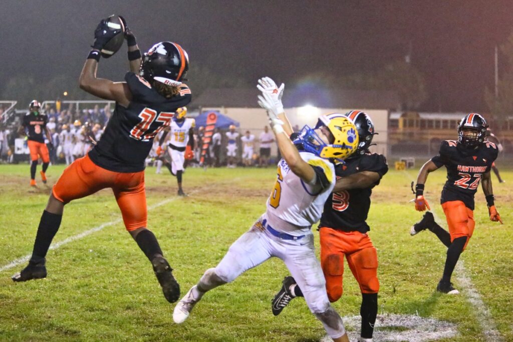 Hawthorne's Nathan Jennings with an interception against Newberry just before halftime on Friday.