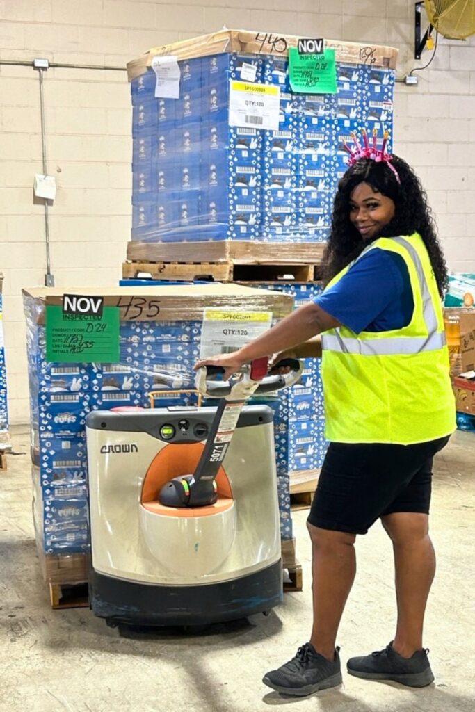 Bread of the Mighty staffer Alfreda Wilson at work in the nonprofit’s warehouse.