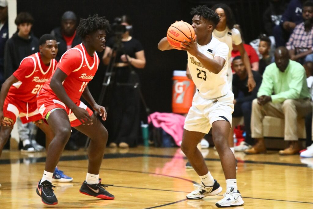 Buchholz's Zewan Hall looks to pass against Santa Fe's Jamie McGhee on Thursday.