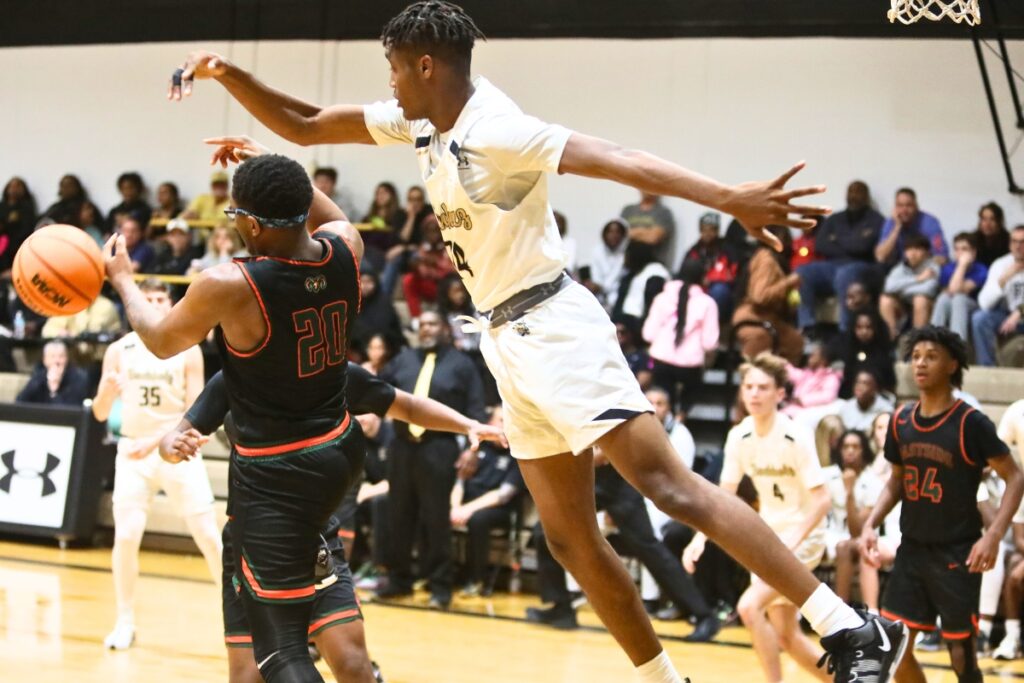 Buchholz's Zion Newkirk with a block against Eastside's Dante Bray.